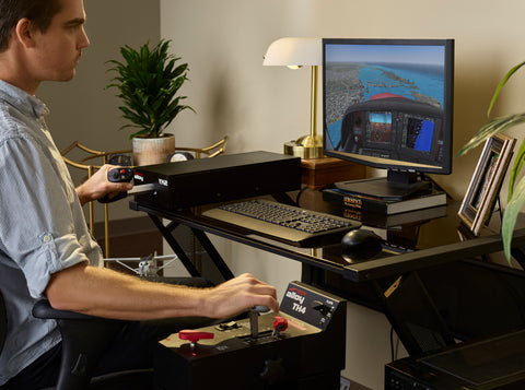 Cirrus pilot flying home flight simulator with the Redbird Alloy YK2 side yoke and Alloy TH4 throttle quadrant